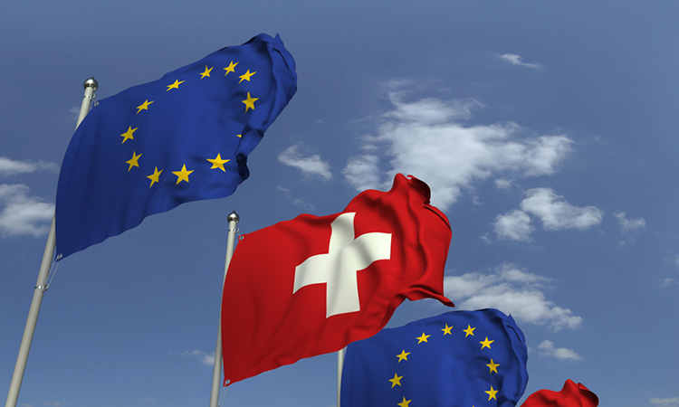 Swiss flag flanked by EU flags